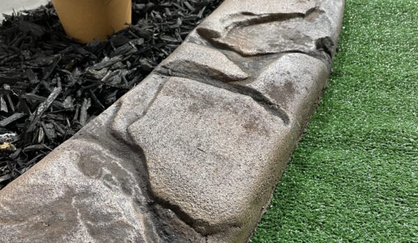 Curb with rock pattern